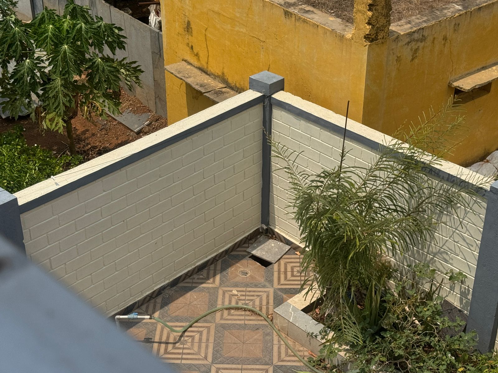 A completed compound wall built by Avani